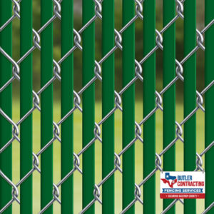 Photo chain link fence with privacy slats in Bastrop County TX