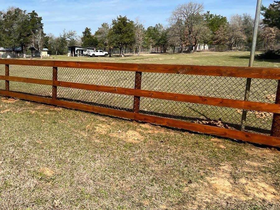 Prestaining wood fences decks pergolas and other outdoor structures in Bastrop Texas