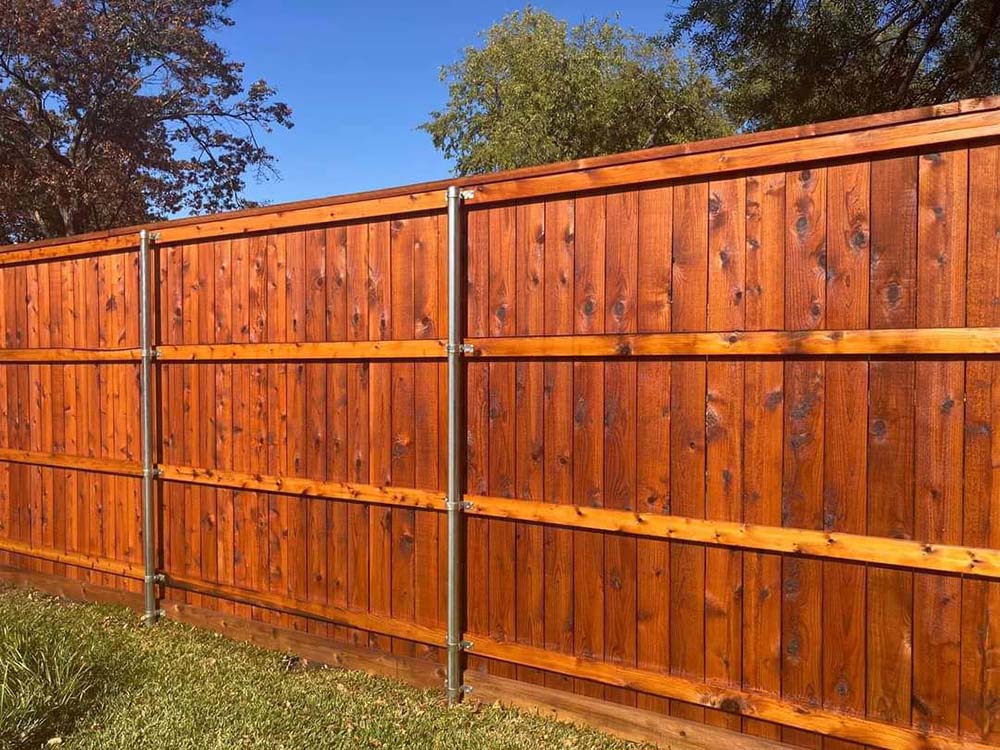 prestain wood fences in Bastrop County Texas