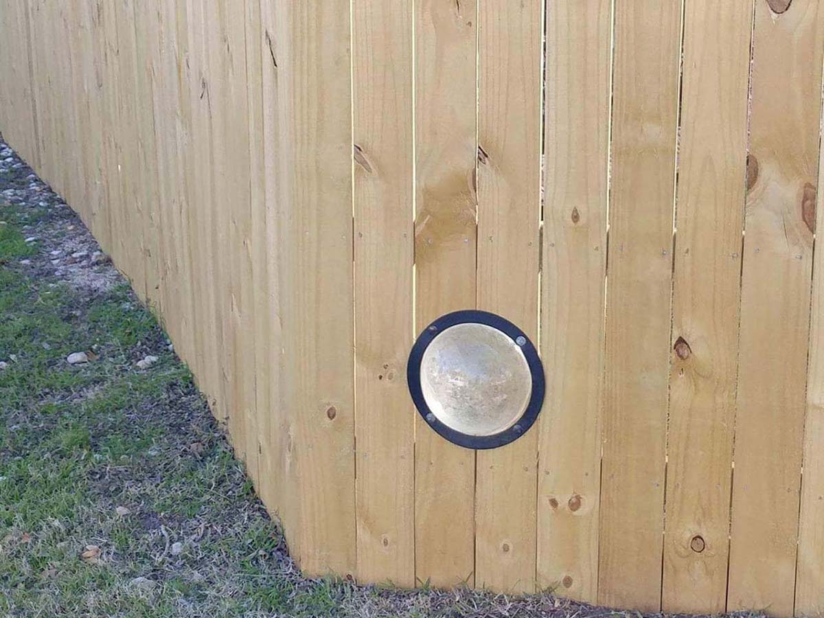 Elgin Texas wood fence with puppy hole fence company 
